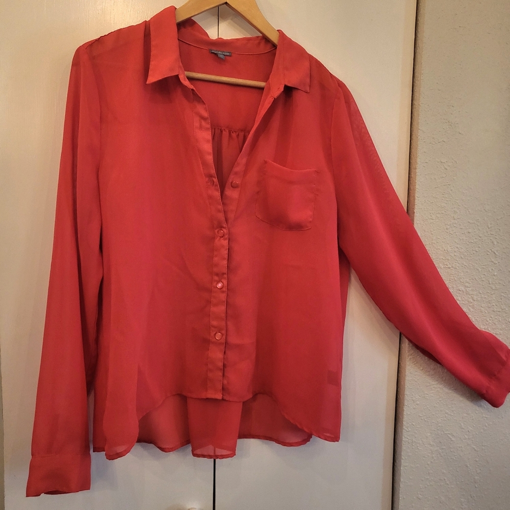 Really cute sheer blouse, bright vibrant red color